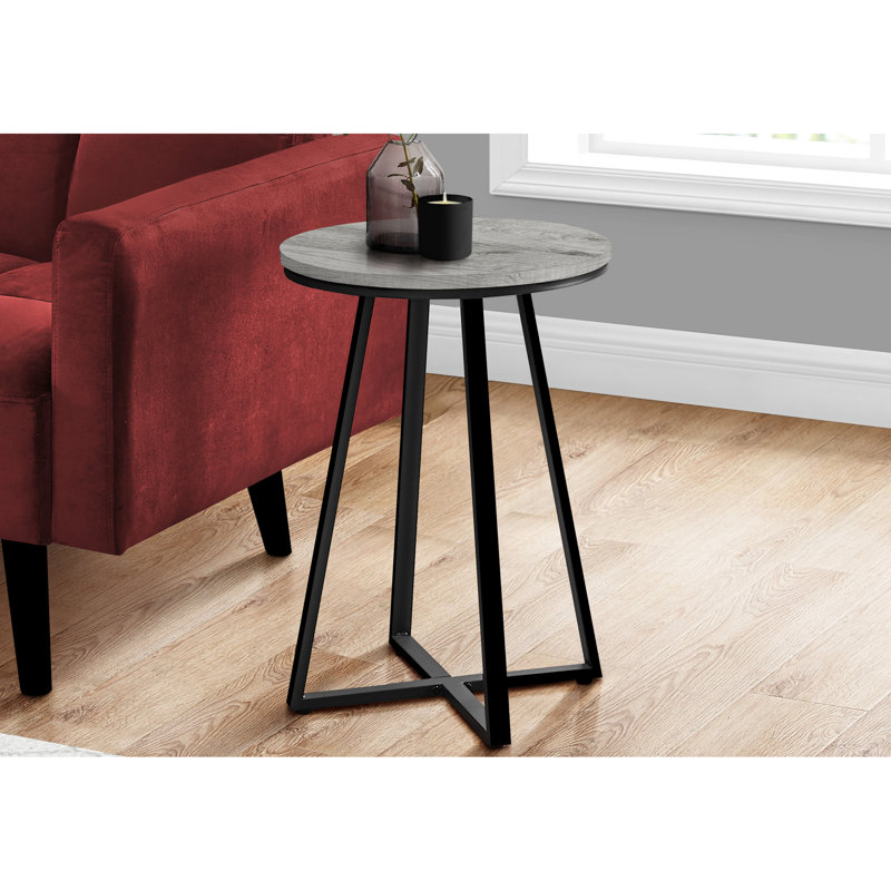 Table ronde élégante pour espaces de vie - Matériaux stratifiés gris et métal noir, style moderne, idéale pour une salle familiale.