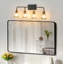 Éclairage pour salle de bain 4 lumières Mid-Century moderne avec élégants globes en verre transparent noir mat et or-129899852