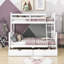 Lit superposé simple au dessus d'un lit double en bois avec 2 tiroirs-113876973