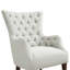 Fauteuil à oreilles capitonné