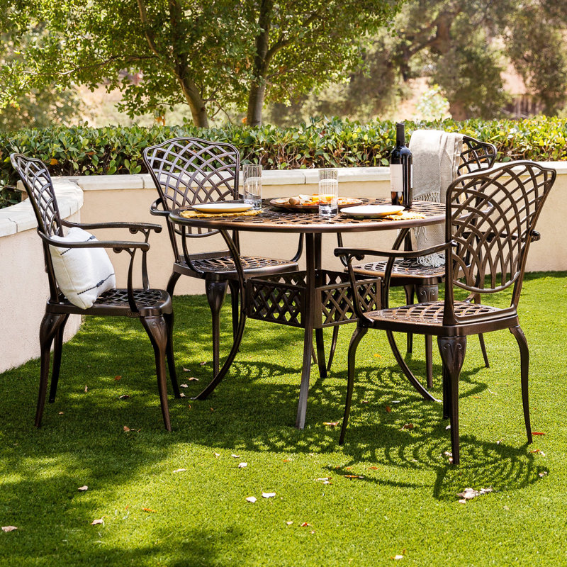 Cynthy 4 - Person Patio Dining Set with Round Table , Cushions Included