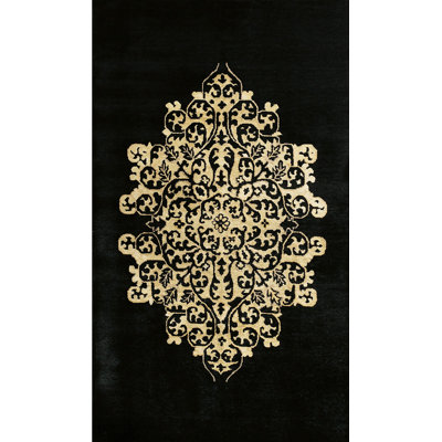 Tapis médaillon floral noir en laine noué à la main des années 1920