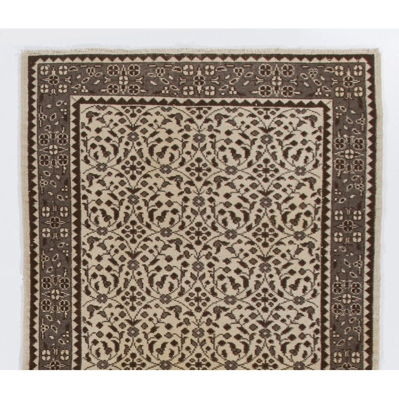 Tapis turc vintage à motif floral fait à la main. Revêtement de sol en laine