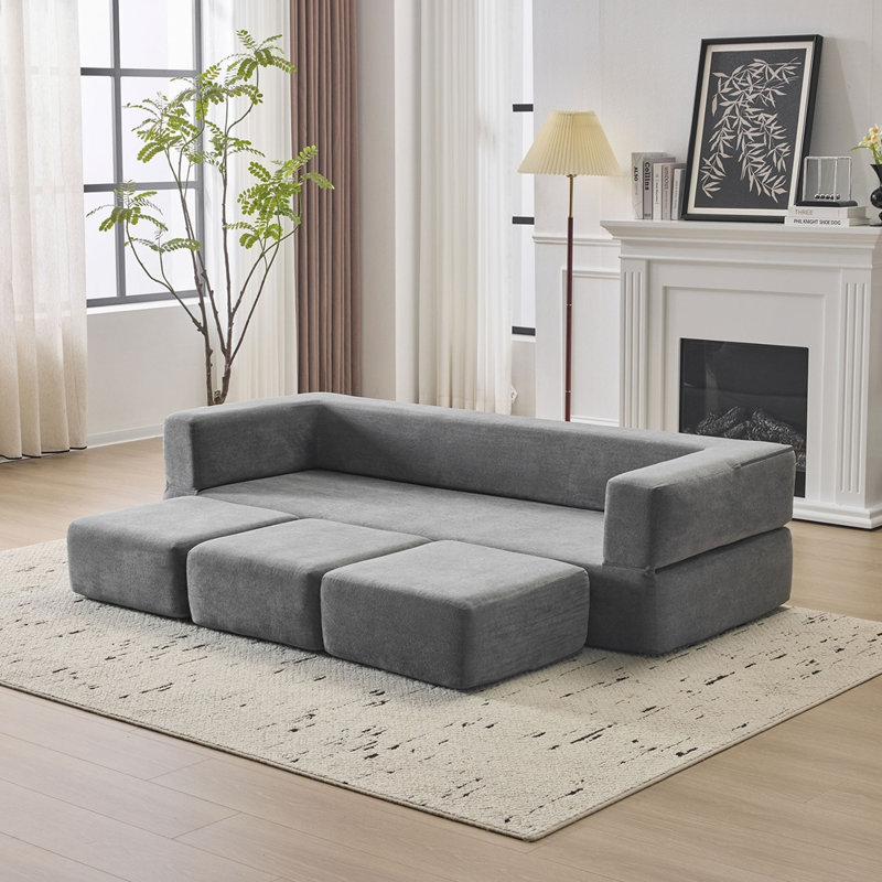 Canapé modulaire convertible 3 pieds avec repose-pieds Ebern Designs, Gris clair