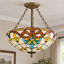Luminaire suspendu vintage rétro en verre teinté avec détails en bronze antique