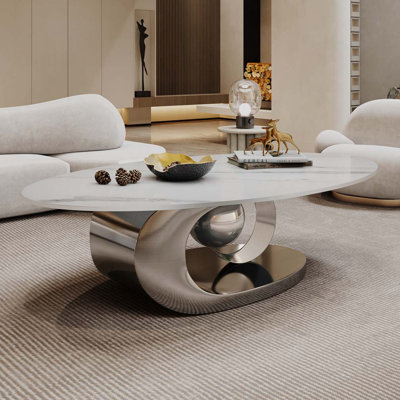 Table basse avec base sculpturale en acier inoxydable