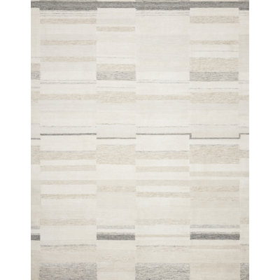 Tapis géométrique ivoire / beige tissé à plat à la main Hutson