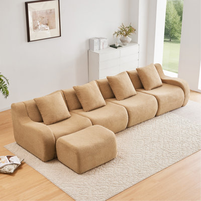 Canapé d'angle 4 places sans dossier, tissu effet peluche, accoudoirs incurvés, design antidérapant, mousse haute densité 32D, emballage sous vide avec compression intégrale, méridienne à monter soi-même, couleur camel