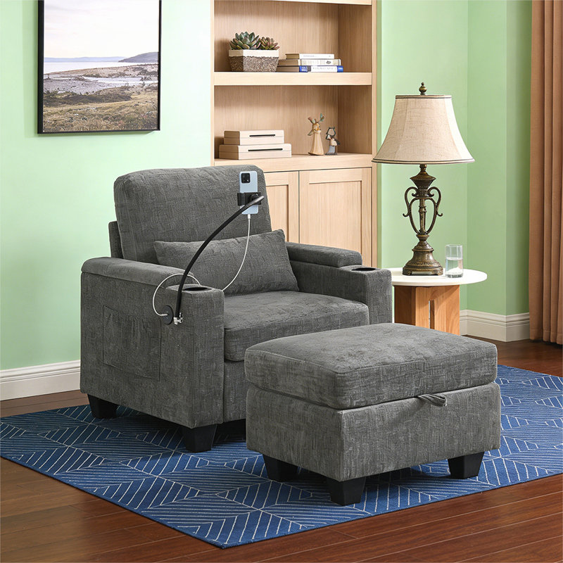 Single sofa recliner with manually adjustable backrest, USB charging port on the armrest side, and a matching storage ottoman