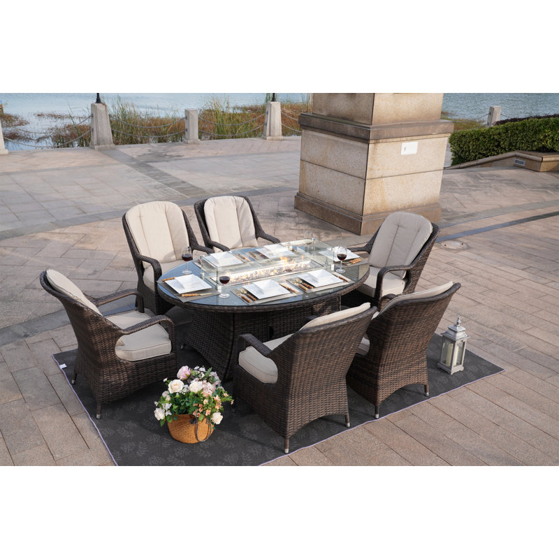 Algird 6 - Person Wicker Patio Dining Set with Oval Table , Cushions Included