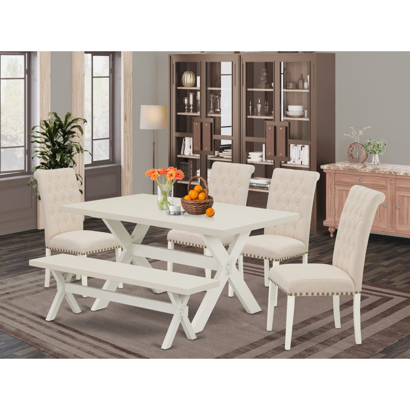 L'ensemble de table de cuisine 6 pièces contient une table de salle à manger rectangulaire avec des pieds en X et 4 chaises Parson en tissu de lin beige clair avec un banc, lin blanc