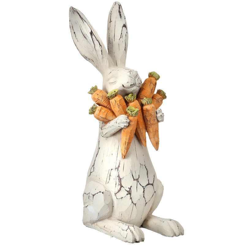 Lapin sculpté en résine avec carottes
