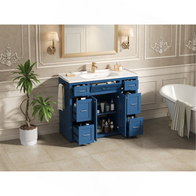 Meuble-lavabo bleu marine 48 po avec lavabo en céramique - 6 tiroirs (3 de chaque côté), tiroir central rabattable, portes doubles à fermeture en douceur, porte-serviettes latéral réversible, poignées argentées, panneau de fibres à densité moyenne