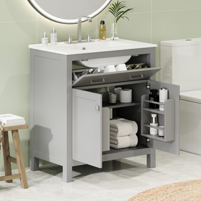 Meuble-lavabo de 30 po avec lavabo en céramique. Armoire grise. 2 portes et tablette réglable. Fermeture en douceur. Améliore la fonctionnalité du meuble-lavabo. Rangement du lavabo. Portes fermées. Assure la stabilité