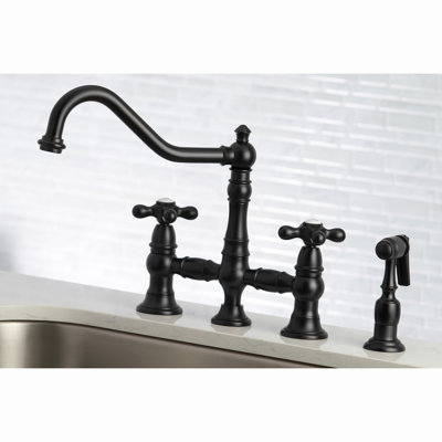 Kingston Brass Restoration Two-Handle 4-Hole Deck Mount Bridge Kitchen Faucet with Brass Side Sprayer