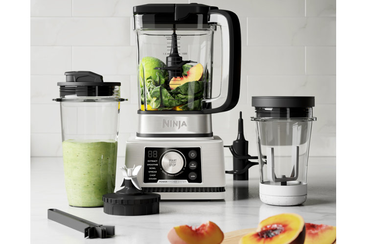 Three different sized blenders on a kitchen counter