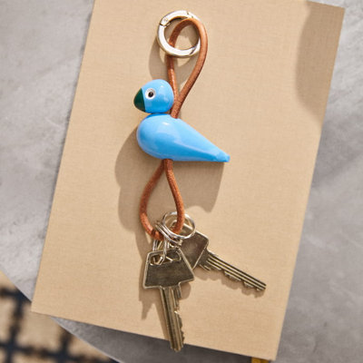 Porte-clés oiseau en métal argenté avec cuir naturel