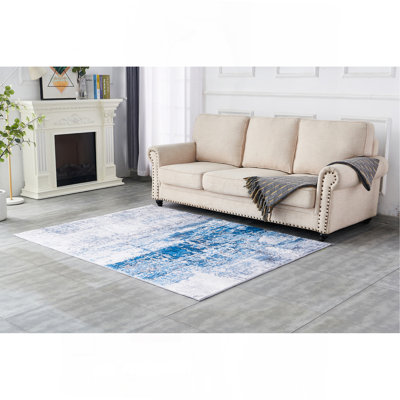 Tapis gris lavable à la machine à motif abstrait à motif abstrait turquoise