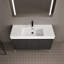 Meuble-lavabo élégant avec lavabo en résine et beaucoup de rangement, idéal pour les salles de bain modernes.