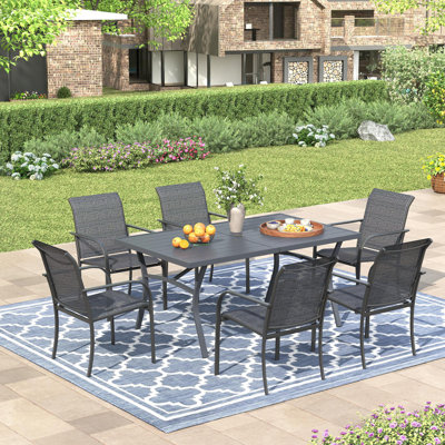 63" Patio Dining Set with Extra Large Rectangular Dining Table and 6 Stackable Armrest Chairs by Lark Manor