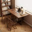 Ensemble de table de salle à manger pliable en bois massif et de 4 chaises avec rangement intégré pour les chaises
