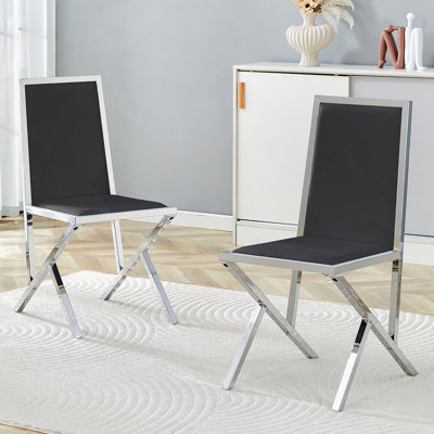 2-Pack Ergonomic Black PU Dining Chairs With Silver Metal Frame, Modern Design And Enhanced Stability For Everyday Use.