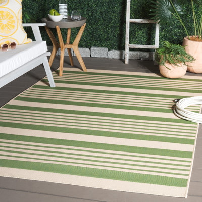 Tapis vert / beige en acrylique tissé à la machine à motif intérieur / extérieur Arneshia