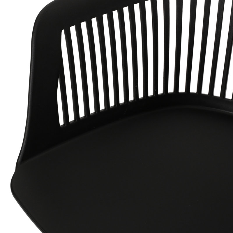 Dahlia Chair - Outdoor. Black Polypropylene, Weather . Elegant Curve. 33''h X 22.5''w 21.5''d. And Stable Frame