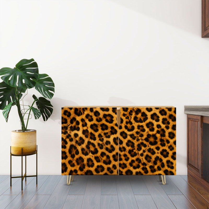 Buffet à deux portes avec rangement dissimulé, motif léopard, imitation peau de panthère ou de guépard. Meuble multifonctionnel idéal pour le salon, la cuisine ou le coin café.