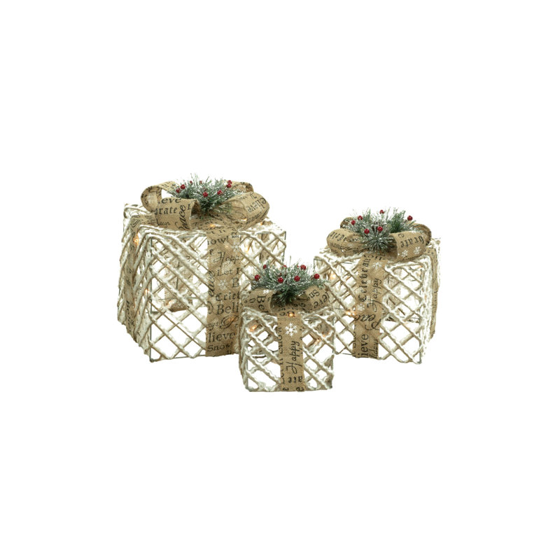 Ensemble de boîtes-cadeaux lumineuses brun recouvert de neige