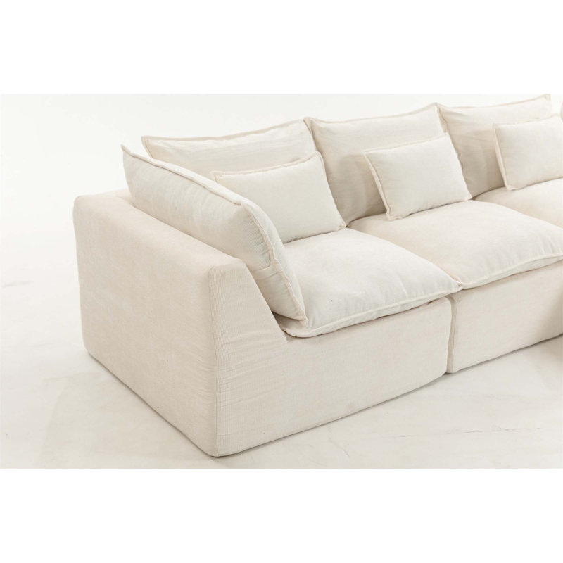 Canapé modulaire surdimensionné surdimensionné avec assise large et profonde, véritable design de relaxation, comprenant un repose-pieds, idéal pour le confort d'un salon spacieux et une configuration flexible.