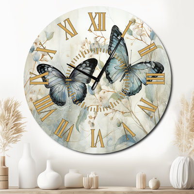 Horloge murale bleue et bleue avec ailes de papillon et sérénité