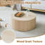 Une table basse cylindrique simple de couleur bois seulement la table, sans chaises.