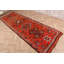 Un tapis turc antique fait à la main rehausse votre couloir avec un charme orange vif et oriental