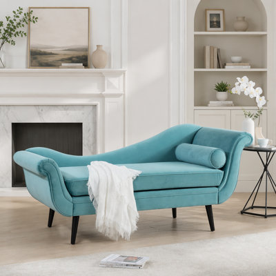Chaise longue rétro avec accoudoirs à volutes, alliant confort moderne et design élégant pour la détente