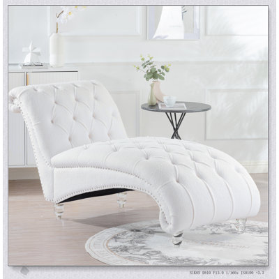 Élégante chaise longue sans accoudoirs capitonnée pour un confort ultime et une décoration élégante, parfaite pour la détente et l'esthétique.