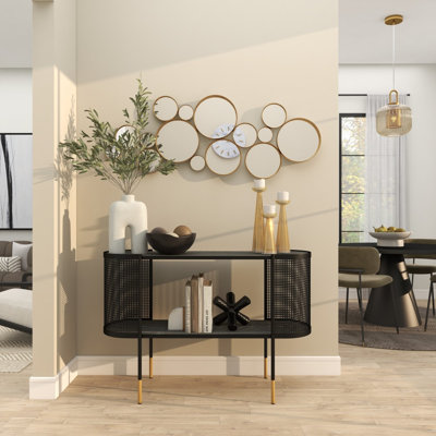 Miroir mural rond en métal doré