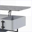 Table basse à plateau relevable gris et blanc avec rangement dissimulé pour le salon
