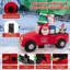 Grand père Noël conduisant une voiture gonflable