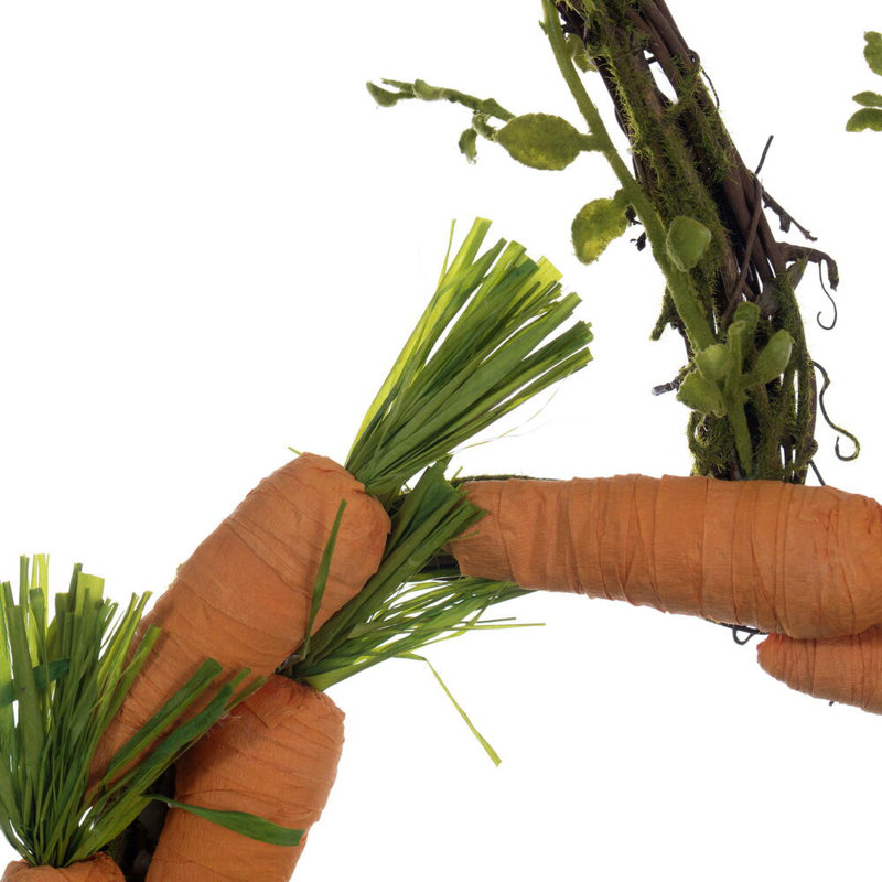 22" Artificial Orange Carrot Wreath. Features orange carrots on a carrot shaped wreath.