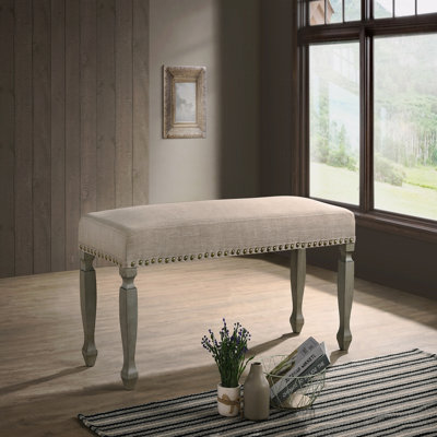 Banc rembourré à têtes de clou