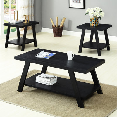 Table basse contemporaine à tablette en bois noire avec rangement supplémentaire et pieds modernes aux angles larges
