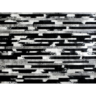 Cojonudo Cowhide Abstract Area Rug