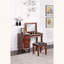 Ensemble de meuble-lavabo traditionnel avec tiroirs de rangement et tabouret capitonné