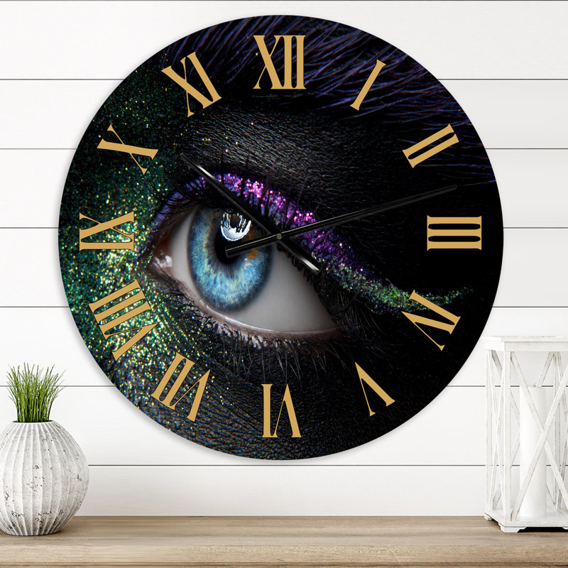 Horloge murale moderne avec yeux féminins et pigments verts et mauves, Petit