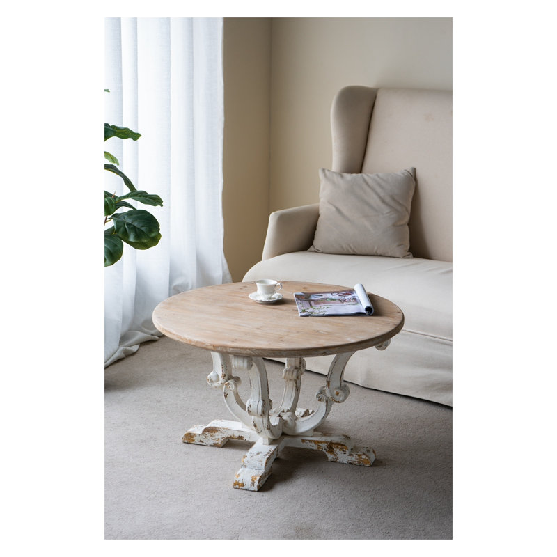 Table basse ronde en bois 31,5 po avec finition blanc antique patiné et pieds à volutes