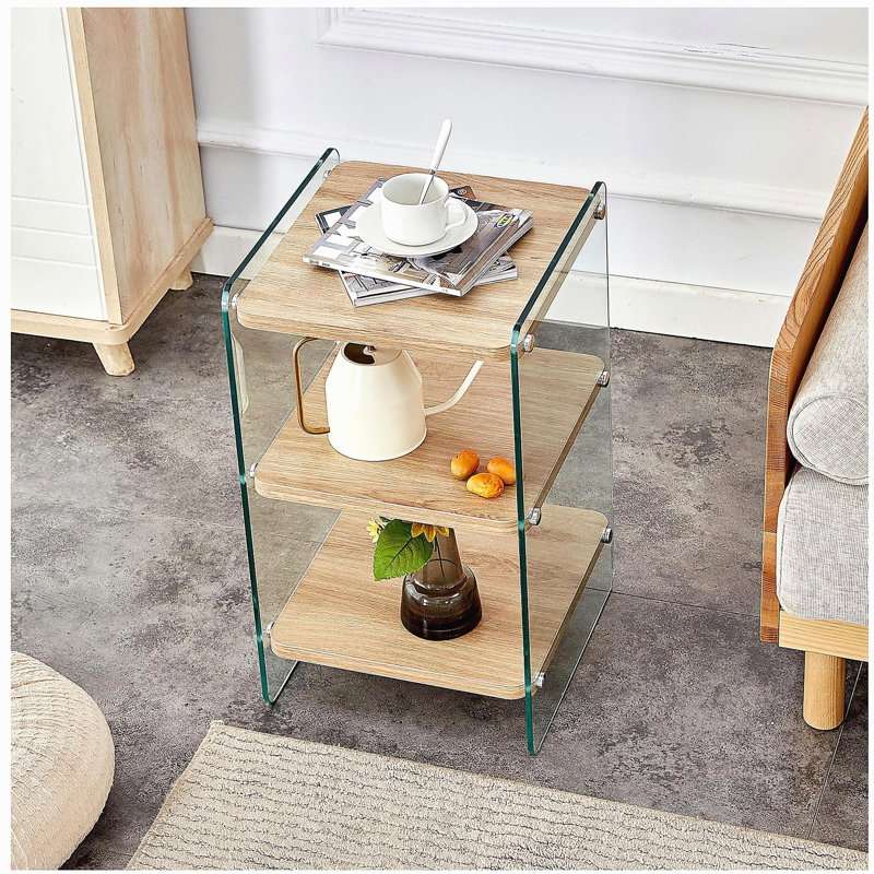 Three-tier bedside table. The panels are made of medium density fiberboard and wood veneer, with transparent tempered glass on both sides. The design is simple and elegant, with strong storage functionality.