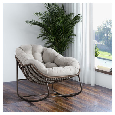 Chaise berçante d'extérieur en acier avec coussin beige pour terrasse, porche et jardin