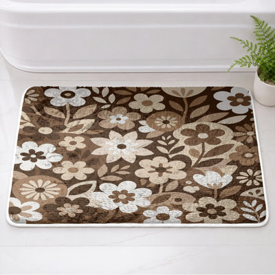Tapis de bain à fleurs noires et blanches