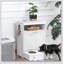 Armoire de rangement blanche avec bols surélevés